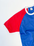 Close-up of a Reworked reclaimed T-shirt turned into a raglan baseball style tee with contrasting sleeves
