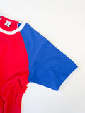 Close-up of a Reworked reclaimed T-shirt turned into a raglan baseball style tee with contrasting sleeves