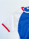 Close-up of a Reworked reclaimed T-shirt turned into a raglan baseball style tee with contrasting sleeves