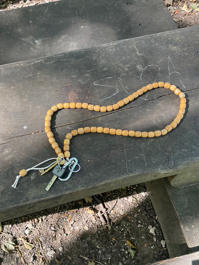Handmade beaded crossbody keyring with natural reclaimed wooden beads and metal carabiner