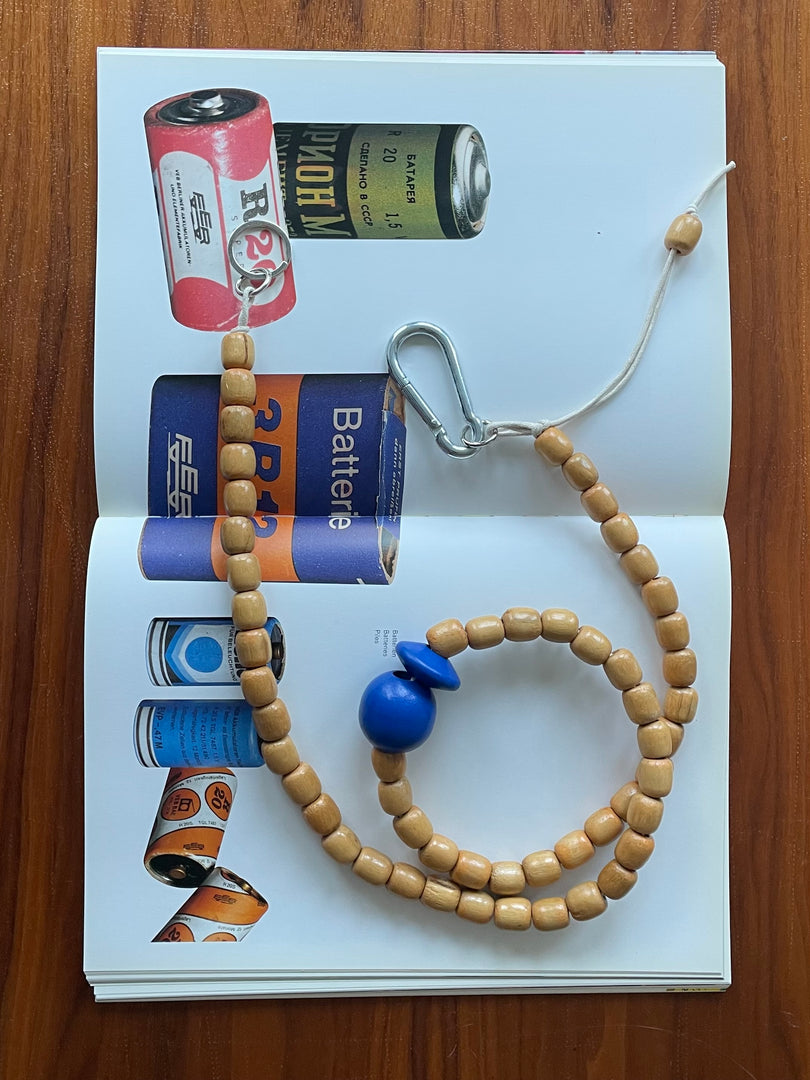 Handmade beaded crossbody keyring with natural and blue reclaimed wooden beads and metal carabiner