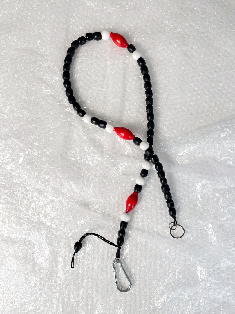 Handmade beaded crossbody keyring with black, white and red reclaimed wooden beads and metal carabiner
