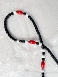 Close-up of reprocessed wooden beads on handmade crossbody keyring showing natural colour variations