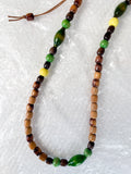 Close-up of reprocessed wooden beads on handmade crossbody keyring showing natural colour variations