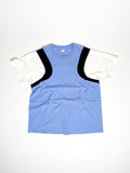 Upcycled panel T-shirt in baby blue, black and white, made from second-hand T-shirts and deadstock jersey. Flat lay on white background.