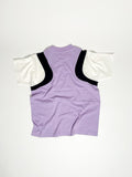 Upcycled panel T-shirt in lilac, black and white, made from second-hand T-shirts and deadstock jersey. Flat lay on white background.