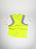 Upcycled panel T-shirt in neon yellow, grey and white, made from second-hand T-shirts and deadstock jersey. Flat lay on white background.