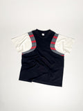Upcycled panel T-shirt in black, grey stripes and white, made from second-hand T-shirts and deadstock jersey. Flat lay on white background.