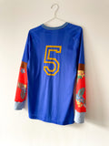 Blue and orange long sleeve football jersey on a white background