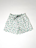 Green and purple Teddy bear print cotton boxer shorts with a board shorts-inspired design, featuring an elastic waistband, white drawstring, and relaxed fit.